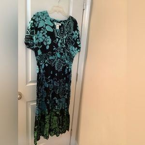 Serengeti variegated floral crossover maxi dress.  In shades of blue, blk. & gr.